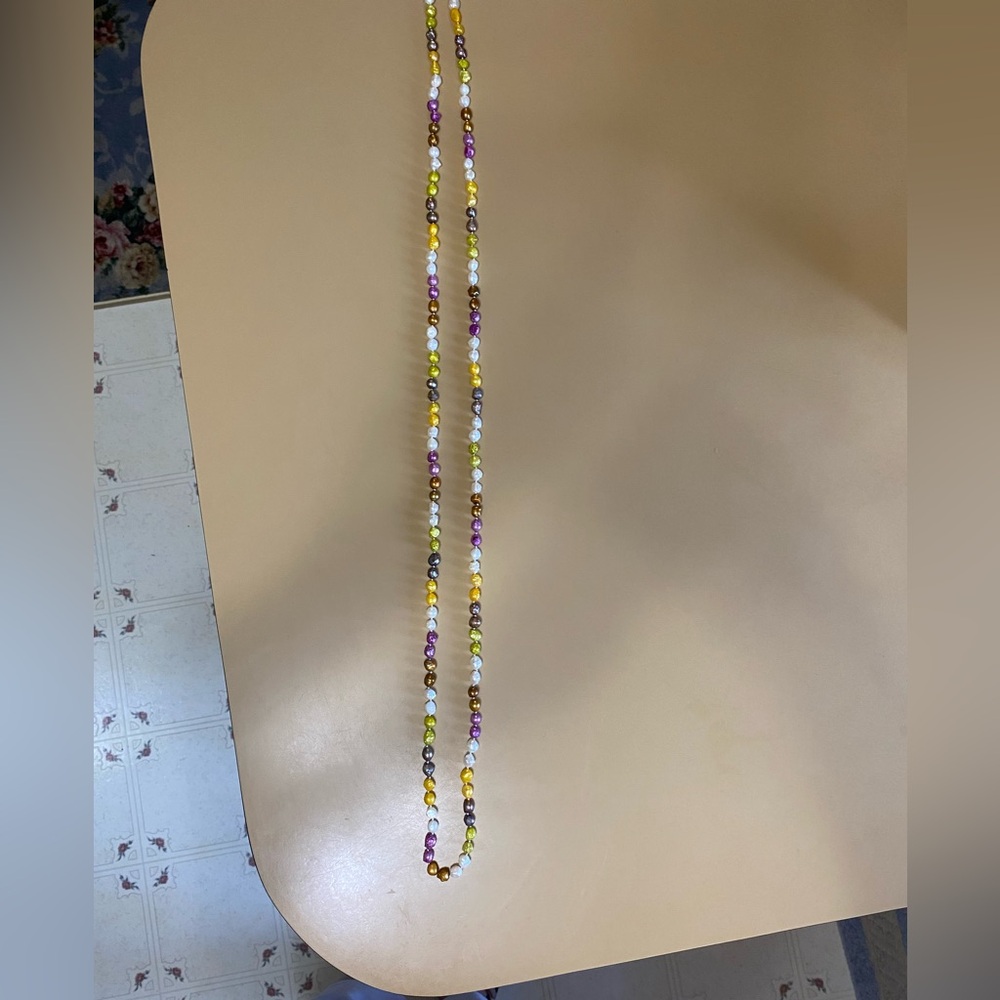 60” dyed Freshwater Pearls necklace with various size pearls.  Continuous strand